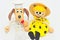 Wooden and string puppets: dog chef and bee