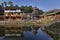 Wooden structure Chinese countryside are reflected in water rive