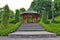 Wooden structure gazebo, in a garden park.