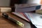 Wooden study table with books and folios