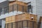 A wooden sukkah inside the balcony of a building, the Jewish holiday of Sukkot