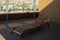 Wooden sun lounger on the roof of the penthouse overlooking the city. Soft selective focus