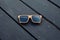 Wooden sunglasses and wooden floor