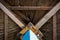 Wooden sunshade, straw umbrella with a blue foot