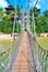 Wooden suspension bridge to paradise