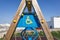 Wooden swing pole with disabled sign and simbol in the playground