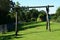 Wooden swing with red seats for children in colony of allotment gardens in Switzerland.