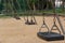 Wooden swing with steel chain.
