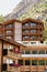 Wooden Swiss chalet in mountains in Zermatt