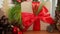 The wooden table is adorned by a Christmas wrapped gift box,Christmas adorned