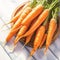 Wooden table adorned with a delightful bunch of fresh carrots