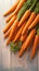Wooden table adorned with a delightful bunch of fresh carrots