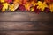 Wooden Table Against Backdrop Of Red And Yellow Fall Leaves Thanksgiving Day