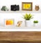 Wooden table on background of shelves with travel objects