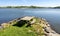 A wooden table with benches on a small cape at Halandsvatnet lake