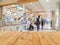 Wooden table with blurred shopping mall