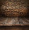 Wooden table with brick background