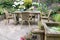 Wooden table and chairs in a ornamental garden