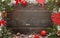 Wooden table with christmas decorations. Top view of board with free space for greeting text