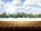 Wooden table with Christmas snowy landscape defocussed in the ba