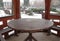 Wooden table covered in ice in a pavilion at winter