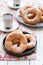 On a wooden table, curd rings on a plate