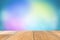 Wooden table with empty space. There are many pastel colored backgrounds blurred