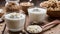 A wooden table with four bowls of food and two glasses of milk