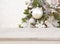 Wooden table in front of blurred decorated Christmas tree background