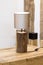 Wooden table lamp made of a piece of wood spruce, a natural original lamp. Glowing bulb wooden table lamp in the interior