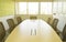 Wooden table in meeting room with sound absorber sunlight from window