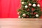 Wooden table near blurred decorated Christmas tree