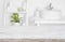 Wooden table over blurred spa salon bathroom shelves background