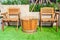A wooden table set on artificial grass for decoration.