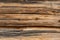 Wooden table surface with weathered boards at sunlight