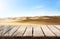 Wooden table top on blur desert background.Hot weather and drink somethings for fresh.Juice and cold water.For montage product