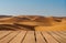 Wooden table top on blur desert background.Hot weather and drink somethings for fresh.Juice and cold water.For montage product