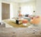 Wooden table top with blur of modern living room interior with orange tone