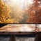 Wooden table top on blurred autumn background - can be used for display or montage your products