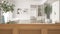 Wooden table top, cabinet, panel or shelf with shutters close up. Olive branch in vase and candles. Blurred background with modern