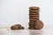 On a wooden table on a white background is a pile of oatmeal cookies sunflower seeds