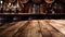 Wooden table with Wine barrels in wine-vaults in order on background