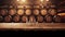 Wooden table with Wine barrels in wine-vaults in order on background