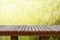 Wooden table or wooden planks with blurred lawn and bokeh circle for background.