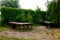 Wooden tables for rest on the grounds of the hotel or park