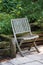 wooden teak chair on the terrace of a private garden