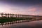 Wooden teak U Bein bridge glowing at sunset