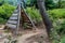 Wooden teepee shaped climbing apparatus