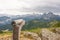 A wooden telescope for observing the top of the mountain. Hiking trail in Austria. In the background, snowy mountains