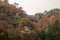 Wooden Temple on mountain during forest  leaves change to orange